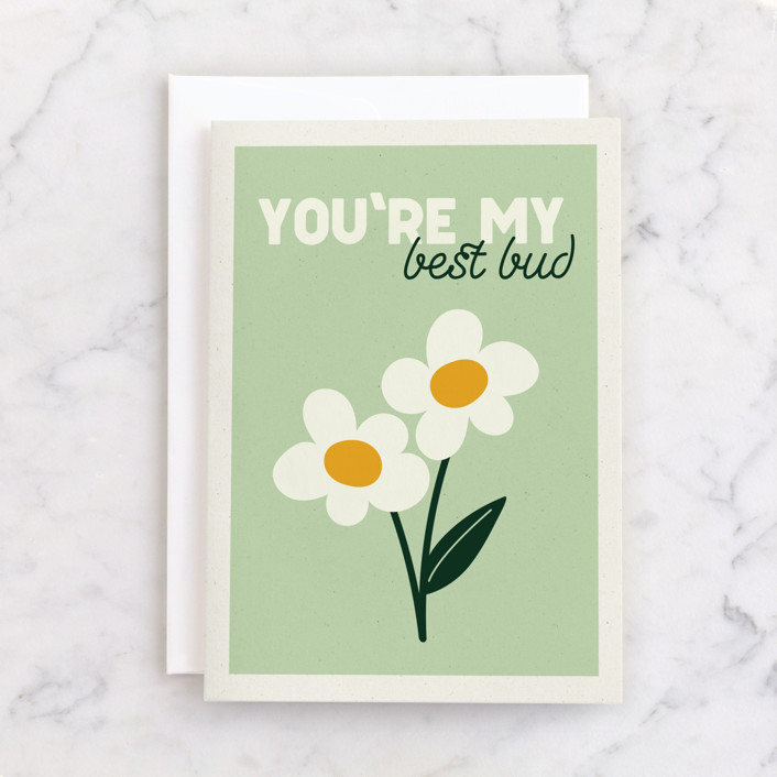 A greeting card with two flowers that says "you're my best bud"